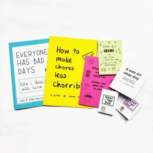 A variety of colourful zines on a white background